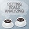 Handwriting text writing Setting Goals Analyzing. Concept meaning Helped to be realistic about what can really achieve Sets of Cup