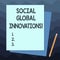 Handwriting text writing Social Global Innovations. Concept meaning new concepts that meets social global needs Stack of