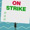 Handwriting text writing On Strike. Concept meaning refuse to continue working because of an argument with an employer