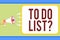 Handwriting text writing To Do List question. Concept meaning Series of task to be done organized in priority order Man holding me