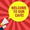 Handwriting text writing Welcome To Our Cafe. Concept meaning Greeting receiving showing in restaurant good attention Hu