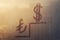 Handwritten doodling sign turkish lira, american dollar icon and pedestal, ladder on sunset foggy glass window