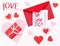 Handwritten Ich-liebe-Dich-note German for Valentine`s Day lying on a red envelope, next to a red parcel, surrounded by red and