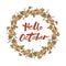 Handwritten lettering Hello October with grapes wreath