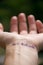 Handwritten motivational phrase on the human hand