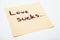 Handwritten note on a yellow sticky paper