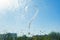 Handwritten question mark on rainy window. Background drop of water on the glass, blue sky, sun