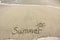 Handwritten summer on sand
