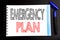 Handwritten text showing Emergency Plan. Business concept writing for Disaster Protection Written on notepad note paper, black bac