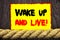 Handwritten text sign showing Wake Up And Live. Conceptual photo Motivational Success Dream Live Life Challenge written on Sticky