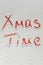 Handwritten text `Xmas time` on the snow