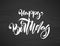 Handwritten textured brush type lettering of Happy Birthday on chalkboard background. Typography design.