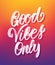 Handwritten type lettering of Good Vibes Only on colorful blurred background