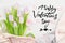 Handwritten Valentine`s day lettering greeting card. Bouquet of pink tulips. Romantic Valentines holidays concept. Top