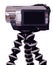 Handycam videocamera with black LCD on tripod