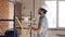 A handyman builder in a helmet is studying a construction plan.