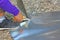 Handyman cutting galvanized steel sheet