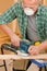 Handyman sanding wooden board diy home renovation