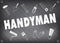 Handyman service logo in grey. Set of repair tools. Lettering Handyman of the pieces.