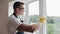 Handyman using screwdriver to fix window handle, repair and installation services