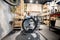 Handywoman with her bicycle in the workshop