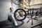 Handywoman reparing bicycle in the workshop