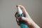 Handâ€‹ holdingâ€‹ theâ€‹ liquidâ€‹ alcoholâ€‹ sprayâ€‹ tube for cleaning and disinfecting the hands.