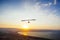 Hang-glider  flight in sky in sunset time over the Kineret, Mevo Hama