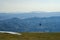 Hang glider just after launch from Monte Cucco Regional Park, Umbria, Italy