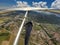 Hang glider pilot flies high over alpine terrain in Provance, Fr