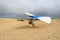 Hang glider student prepares for takeoff on sand dunes in North Carolina