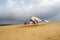 Hang glider student prepares for takeoff on sand dunes in North Carolina