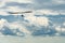 Hang glider wing silhouette and beautiful sky with clouds