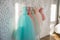 Hanger with colorful elegant puffy dresses for girls. holiday wardrobe.