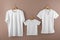Hangers with blank white t-shirts on color background