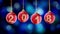 Hanging 2018 number glitter Christmas balls on blue bokeh background.
