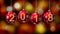 Hanging 2018 number glitter Christmas balls on gold bokeh background.