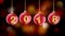 Hanging 2018 number glitter Christmas balls on gold bokeh background.