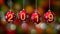 Hanging 2019 number glitter Christmas balls on gold bokeh background. 4K