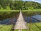 Hanging bridge goes over river