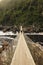 Hanging bridge over dark river