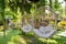 Hanging chairs on tropical garden