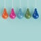 Hanging colorful pantone pastel light bulbs different idea on light blue background