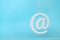 Hanging Email Icons Against a Blue Background
