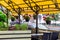 Hanging flowerpots with decor for a street cafe terrace.