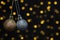 Hanging Gold and silver Christmas ornaments against bokeh background