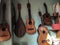 Hanging guitars in a green wall