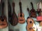 Hanging guitars in a green wall