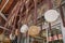 Hanging handmade woven bags in front of store. Beads ornaments hanging from above in front of store