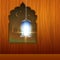 Hanging illuminated Arabic lamp.